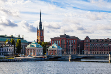 Fototapeta premium STOCKHOLM, SWEDEN - SEPTEMBER 17, 2016: Gamlastan and Town Hall. Panoramic view with bridge