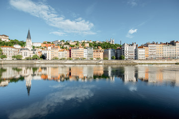 Fototapeta na wymiar Morning view on the riverside with saint George cathedral in the old town of Lyon city