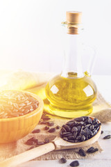 Fototapeta na wymiar Sunflower seed and oils on wooden table.