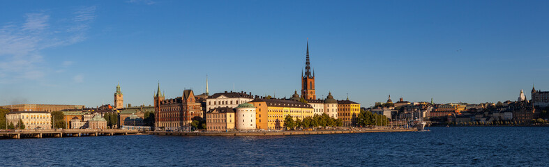 Naklejka premium STOCKHOLM, SWEDEN - SEPTEMBER 19, 2016: Scenic summer sunset panorama of the Old Town (Gamla Stan) architecture
