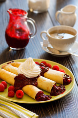 Dessert Crepes with Berry Sauce, Raspberries, and Whipped Cream and Hot Herbal Tea