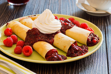 Berry Filled Dessert Crepes with Whipped Cream and Raspberries