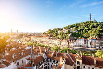 Morning aerial cityscape view with beautiful old buildings and metallic tower on the mountain in Lyon city in France