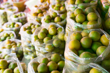 Fresh mandarin orange background on the fruit market showcase.