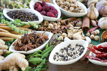 black pepper ,white pepper and ingredient  on wood background concept for herb and spicies background