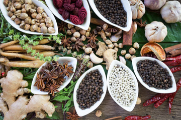 black pepper ,white pepper and ingredient  on wood background concept for herb and spicies background