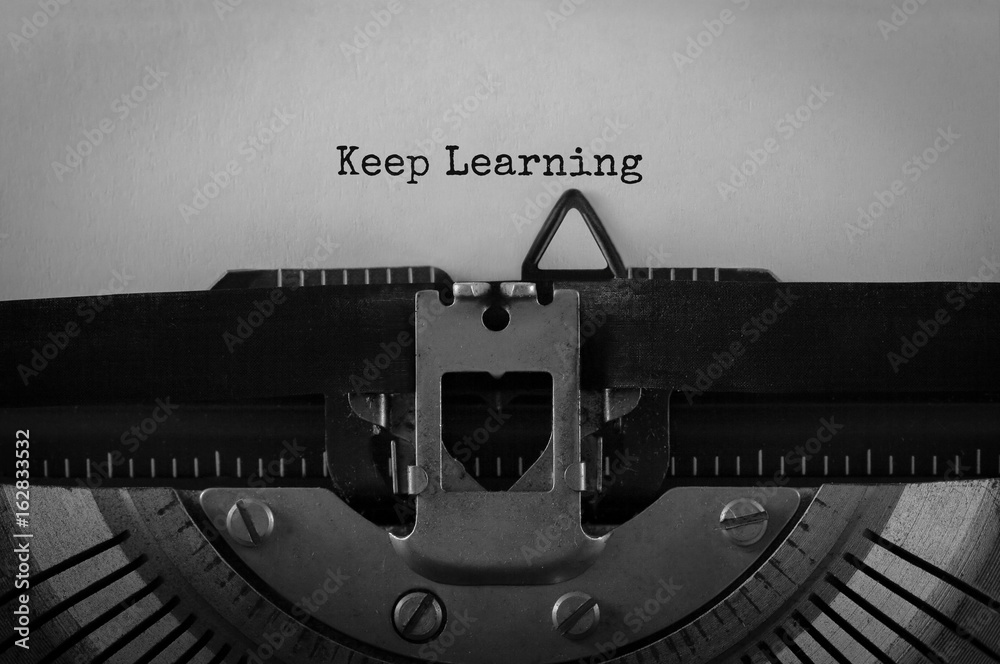 Poster text keep learning typed on retro typewriter