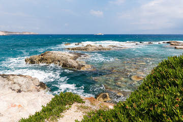 Azure sea water of Mandrakia in windy day, Milos Island. Greece.