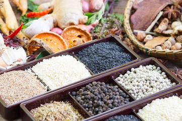 black pepper ,white pepper and ingredient  on wood background concept for herb and spices background