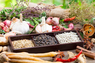 black pepper ,white pepper and ingredient  on wood background concept for herb and spices background