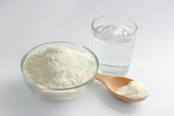 Fototapeta na wymiar Flour and water on white background