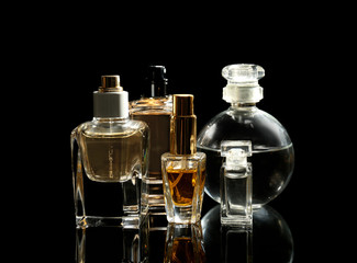 Perfume bottles on black background