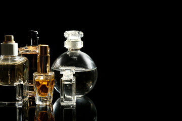Perfume bottles on black background