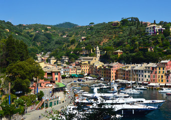 Fototapeta na wymiar PORTOFINO, ITALY - JUNE 13, 2017: spectacular panorama of Portofino town with its harbour with yachts and boats, Portofino, Liguria, Italy