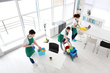 Service team cleaning office