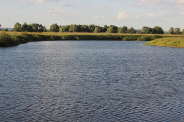 landscape with river and trees at sunset