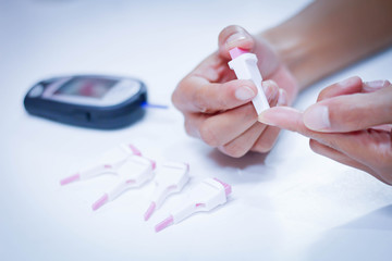 woman monitor blood glucose levels
