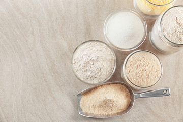 Composition with different types of flour on table