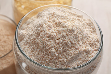 Glass jar with rye flour, closeup