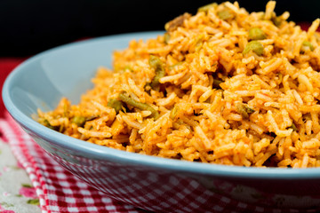 Homemade Chinese fried rice with vegetables and fried eggs