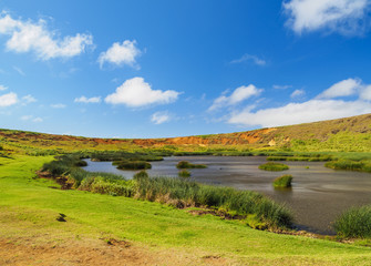 Fototapeta premium Lake in the crater of the Rano Raraku Volcano, Rapa Nui National Park, Easter Island, Chile