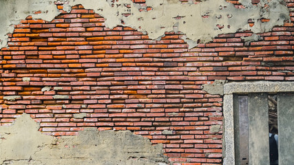 Old rustic brick and cracked plaster texture background
