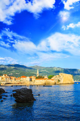 Fototapeta premium BUDVA, MONTENEGRO - JULY 10: Beautiful view of the old town of Budva and the bell tower of the Church of St. John on July 10, 2016 in Budva.
