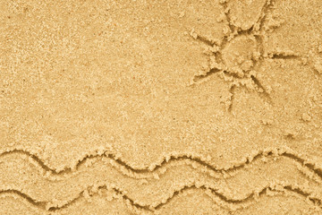 sea waves and sun drawing in sand