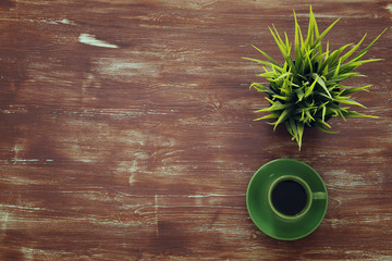 Top view image of coffe cup on wooden background. Flat lay