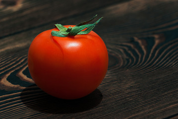 Ripe Red Tomatoes on a Wooden Table