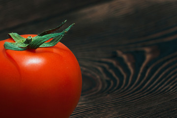 Ripe Red Tomatoes on a Wooden Table