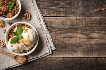 Vanilla ice cream with nuts and caramel sauce
