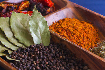 spices and herbs on wooden plate