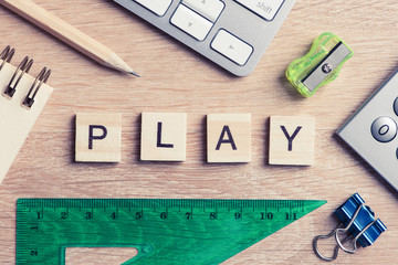 Elements of education game spelling words on wooden office table
