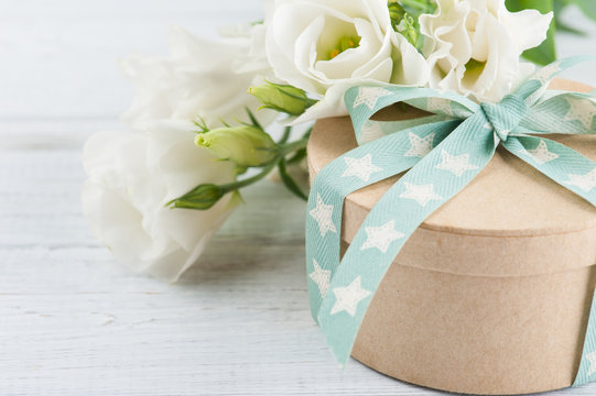 Gift box, bow and flowers