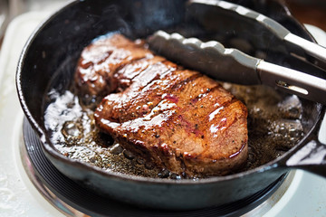 Angus teak fried on vegetable oil on iron cast 