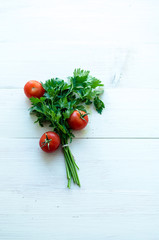 Bunch of fresh parsley on white boards.
