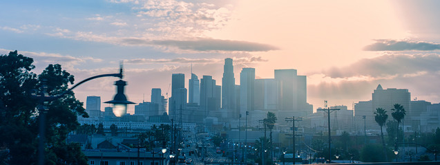 Spectacular urban panoramic skyline view of downtown Los Angeles at sunset from 5 freeway,...