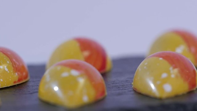 Colorful candies close up. Set of colorful lollipops. Red and yellow Christmas candy. Slow motion
