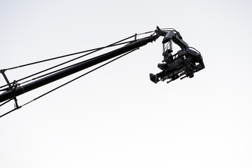 Live event video camera on crane over white
