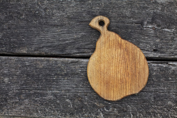 vintage cutting board on old wooden background
