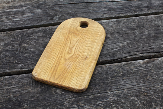 vintage cutting board on old wooden background