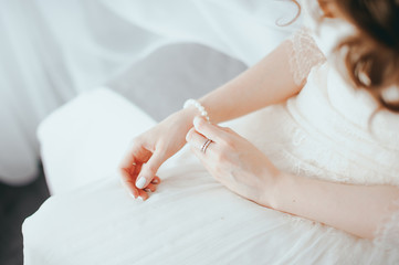the bride wears a bracelet on hand