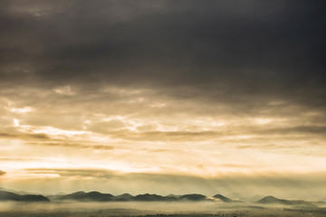 mountains landscape under morning sky with clouds.