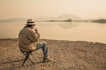 Fototapeta premium Young man drinking coffee in the moning