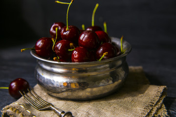 cherries in bowl on the table