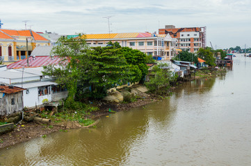 Fototapeta premium Riverside stilt houses in the Mekong Delta