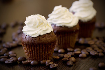 Cupcakes with creame and coffee beans