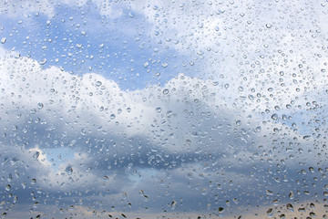 Fototapeta na wymiar Raindrops on the glass