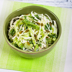 Coleslaw Cabbage Salad with Pumpkin Seeds. Selective focus.